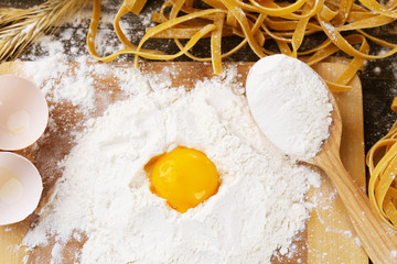 Still life with raw homemade pasta and ingredients for pasta