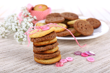 Sugar cookies in shape of buttons on table