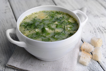 Delicious green soup with sorrel on table close-up