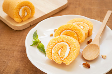 Orange roll cake on plate