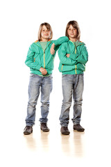 Fototapeta premium Twin brothers posing on white background