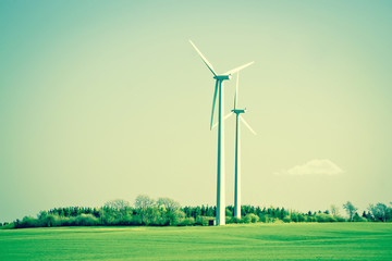 Obraz premium Green energy windmills in beautiful landscape