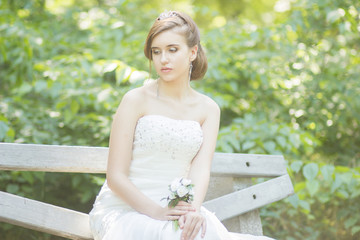 Portrait of a beautiful young bride in nature