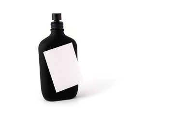 post-it note sticked on a black bottle