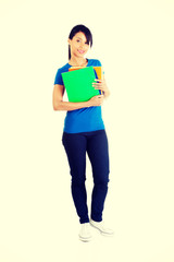 Happy student woman with notebooks