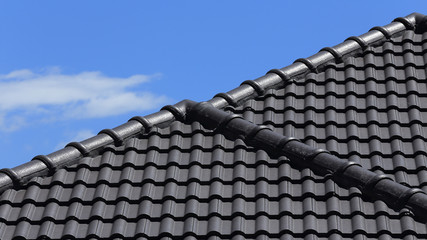 black tiles roof on a new house