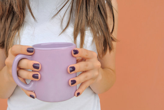 Girl with a violet mug coffee