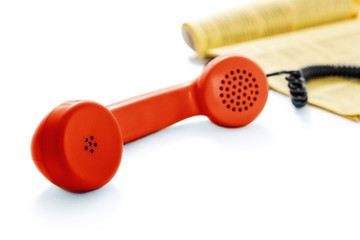Red old phone and phone directory -Clipping Path