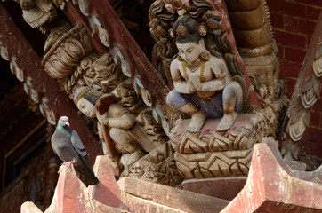 Hindu gods and dove - traditional wooden temple decoration,Nepal