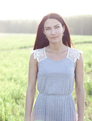 Woman in a dress standing in a field
