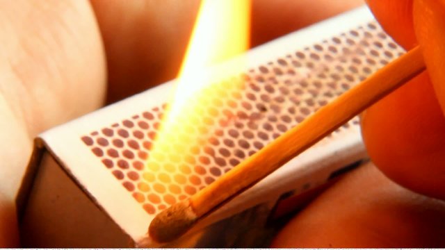 strike a match on the matchbox
