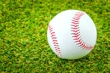 Baseball on green grass