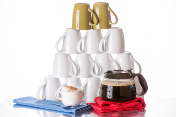 Stacked coffee mugs, fresh coffee and cappuccino