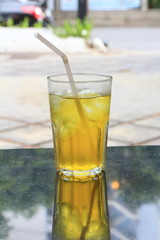 Chrysanthemum Tea with Ice in Glass on Table.
