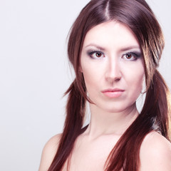 Fototapeta premium Beautiful girl with red hair on gray background