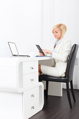 business woman using tablet bright ofice desk