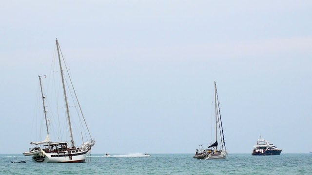 Jetskis, Jet Boats Sailing between Boats and Yahts. Sea
