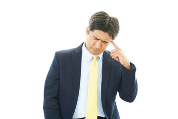 頭痛を訴えるビジネスマン