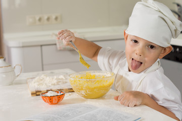 Silly young chef sticking out his tongue