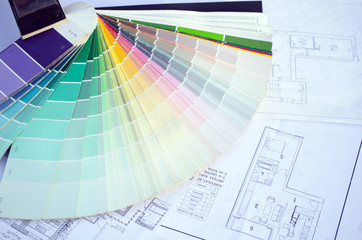 color palette samples lie on house design drawings