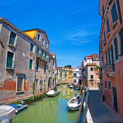 Venice canal, bridge, houses and the boats