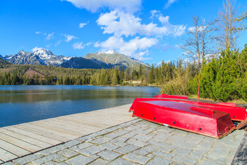 Red boats near lake in Strbske Pleso, Slovakia