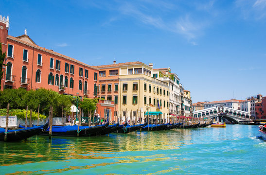 Venice Grand canal with gondolas and Rialto Bridge, Italy