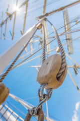 Wooden pulley on an old yacht vertical.