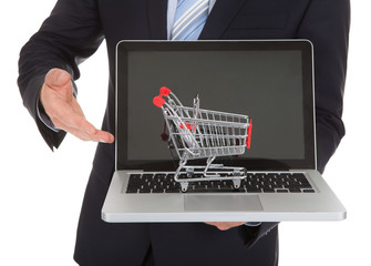 Businessman With Laptop And Shopping Cart Model