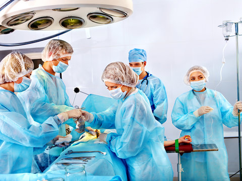 Surgeon at work in operating room.