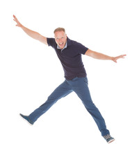 Cheerful Young Man With Hands Raised