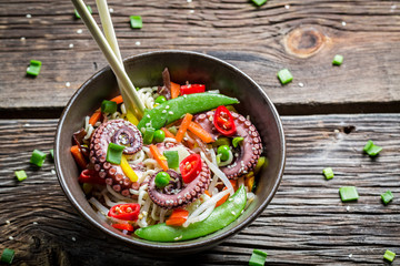 Octopus with vegetables and noodles