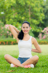 Naklejka na ściany i meble Young Woman doing Yoga Exercises Outdoor.