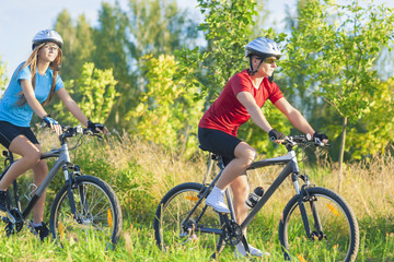 Fototapeta na wymiar Couple Training Together on Bikes