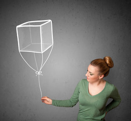 Woman holding a cube balloon