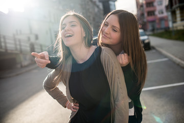 A girl pointing something other girl