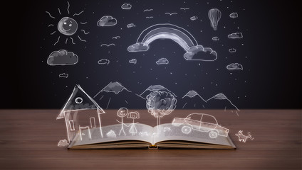 Open book with hand drawn landscape