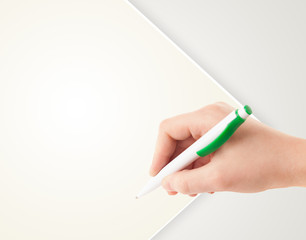 Hand writing on plain empty white paper copy space