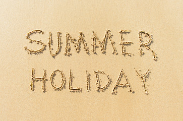 Word summer holiday on beach