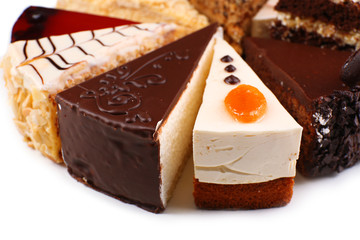 Assortment of pieces of cake, isolated on white © Africa Studio