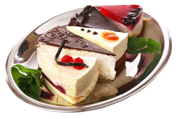 Assortment of pieces of cake, isolated on white © Africa Studio