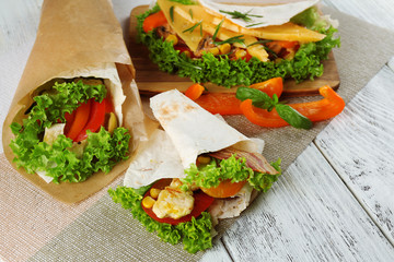Veggie wrap filled with chicken and fresh vegetables