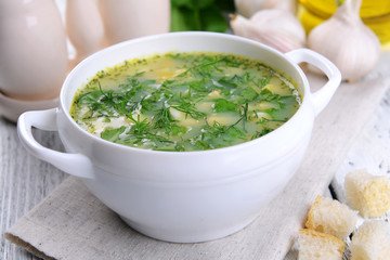 Delicious green soup with sorrel on table close-up