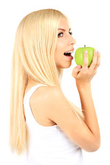 Young beautiful woman with apple isolated on white