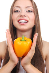 Beautiful girl with yellow pepper, isolated on white