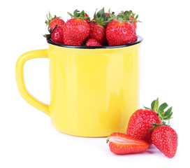 Ripe sweet strawberries in color mug isolated on white