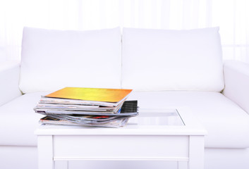 Magazines on coffee table in room