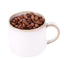 Cup  with coffee grains isolated on white