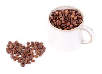 Cup  with coffee grains isolated on white