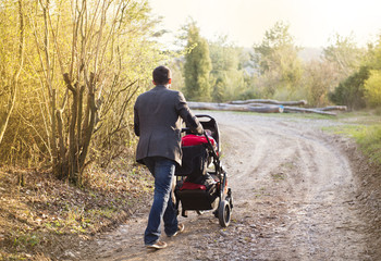 Mother with pram in nature